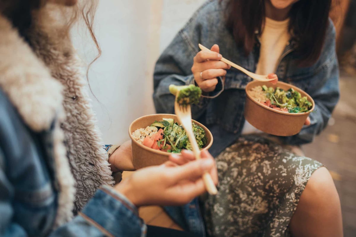 girls eating vegetables