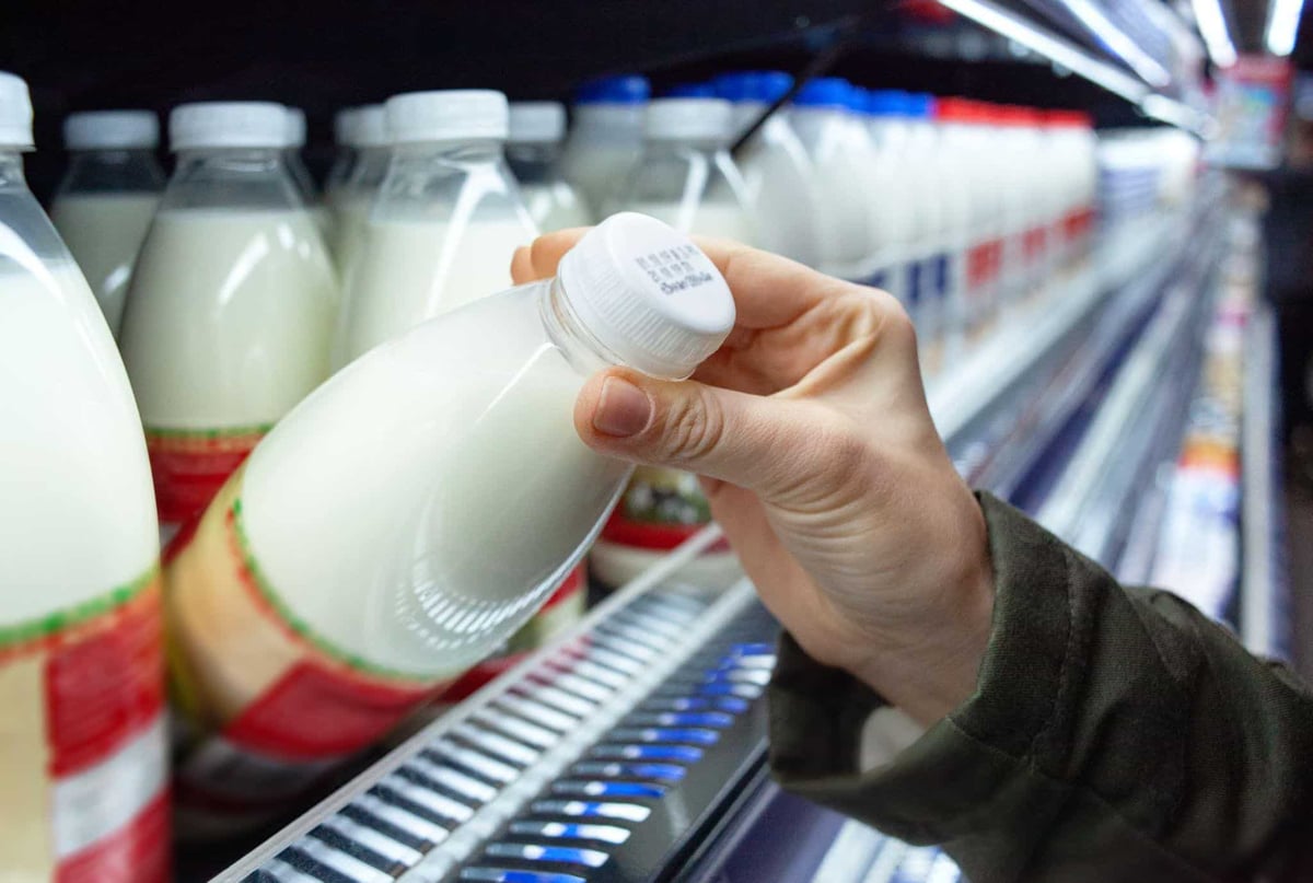 milk bottle in a supermarket fridge