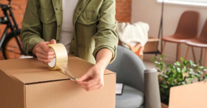 Man taping up a package