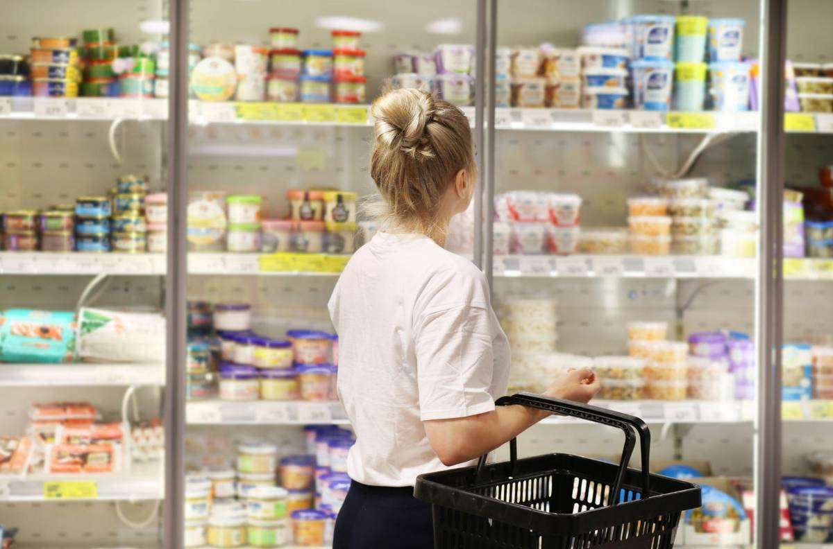 girl picking items at a supermarket