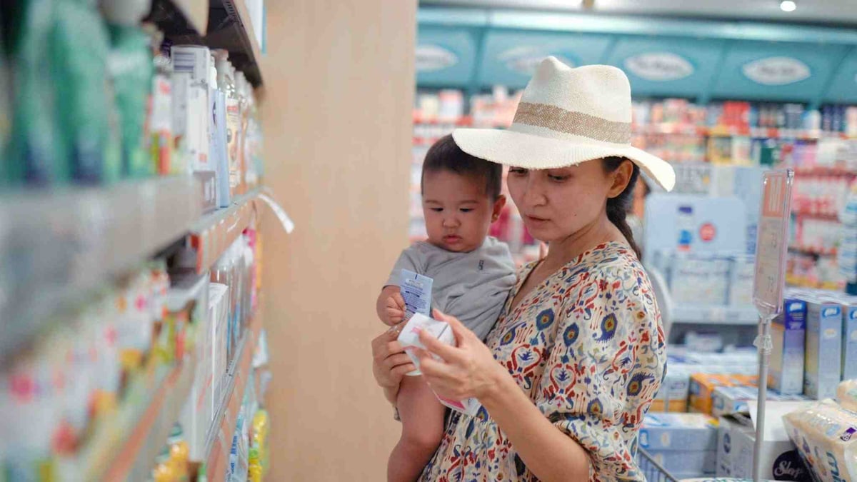 mom picking a product off the shelves