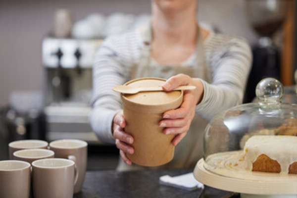 Woman holding a cardboard food box