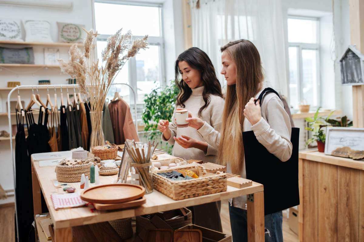 two women picking products in a boutique 