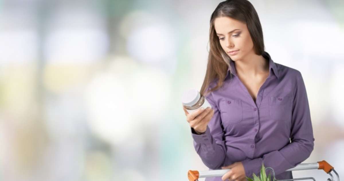 Woman reading a food label